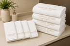 8 piece white towel set with 'Yahweh Homes' branding on a wooden surface.