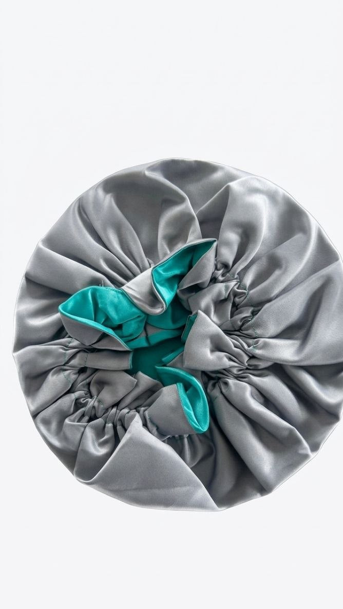 Gray satin hair bonnet with on a white background