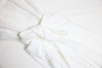 Close-up of white robe 