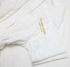 Elegant unisex bathrobe with embroidered Yahweh Homes logo, perfect for lounging, spa days, and restful mornings.