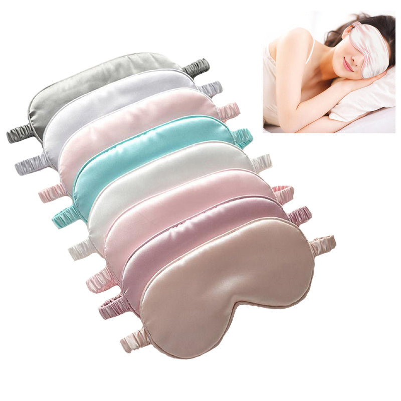 Set of colorful eye masks with a woman sleeping in the corner.