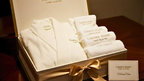 Luxury bath gift set featuring plush cotton towels and a soft spa-style robe, neatly packaged for relaxation and everyday comfort.